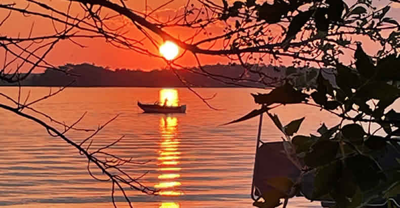 Taking a boat ride on Star Lake to catch the sunrise and a morning fish bite.